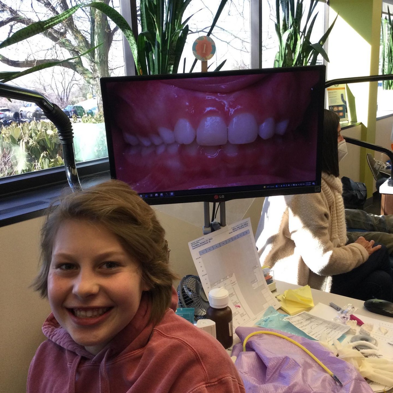 Patient showing before and after of their teeth